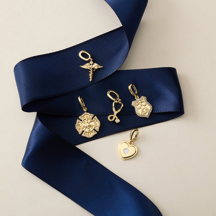 gold charms on blue ribbon