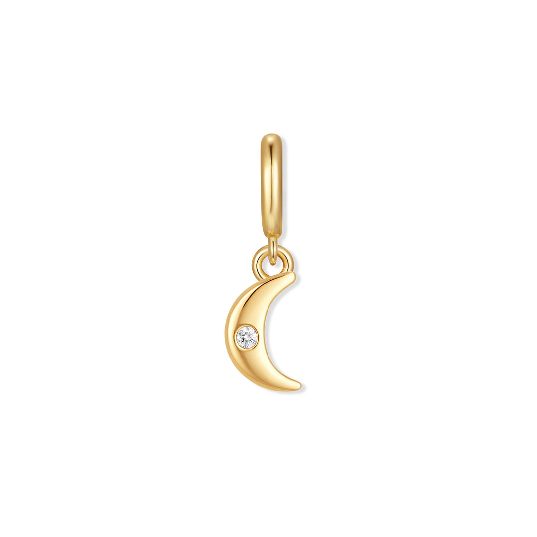 Gold-tone crescent moon charm with a flush-set round crystal and a ring clasp for attaching to bracelets or necklaces.