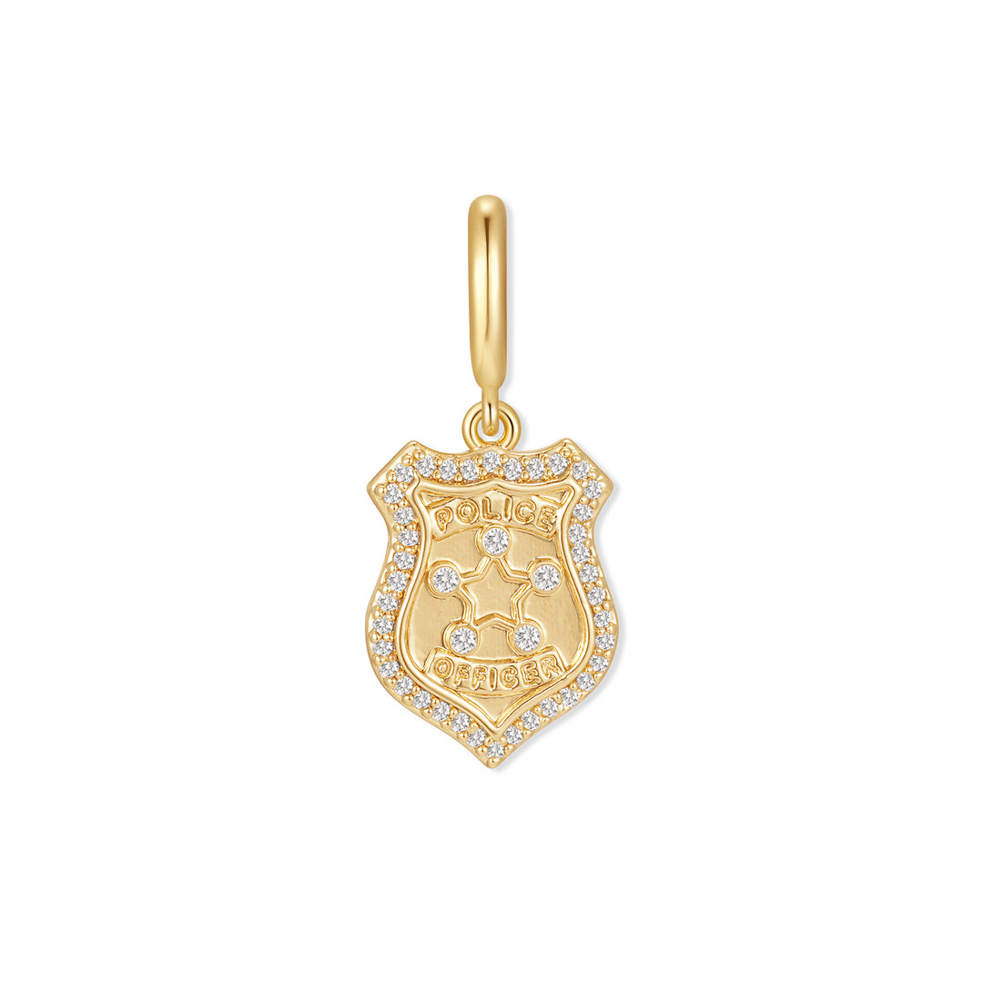 Gold-tone police badge charm with a diamond-pavé border, engraved star and "Police Officer" text, suspended from a ring clasp.