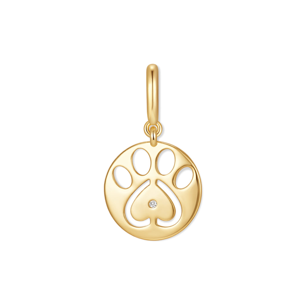 Gold-tone round charm with a cutout paw print design, heart-shaped pad detail, and a single diamond accent at center.
