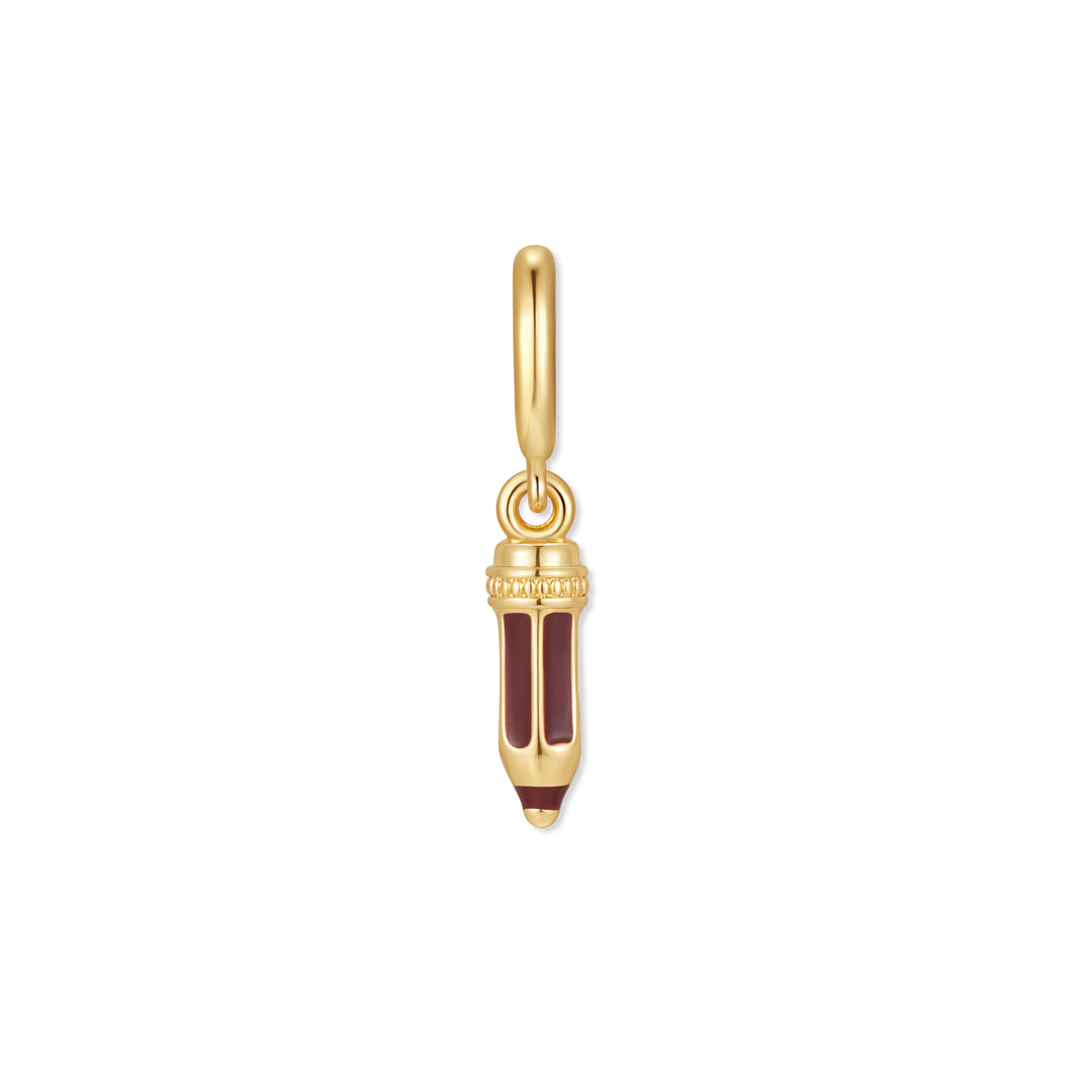 Gold-tone pencil charm with deep red enamel body, engraved collar detail, and a pointed tip, hanging from a gold-tone ring clasp.