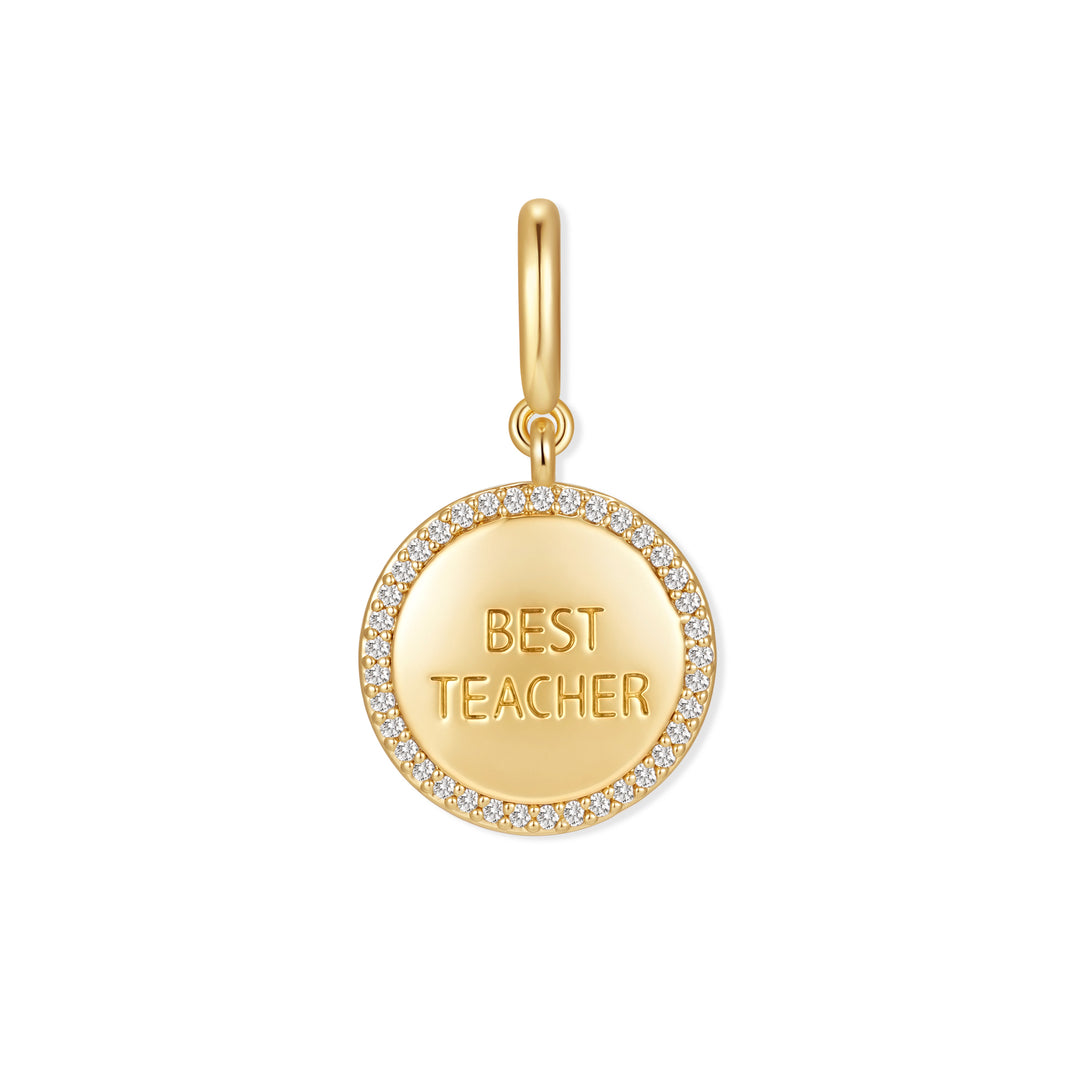 Gold-tone "Best Teacher" round disc charm with a pavé crystal border and ring clasp bail.