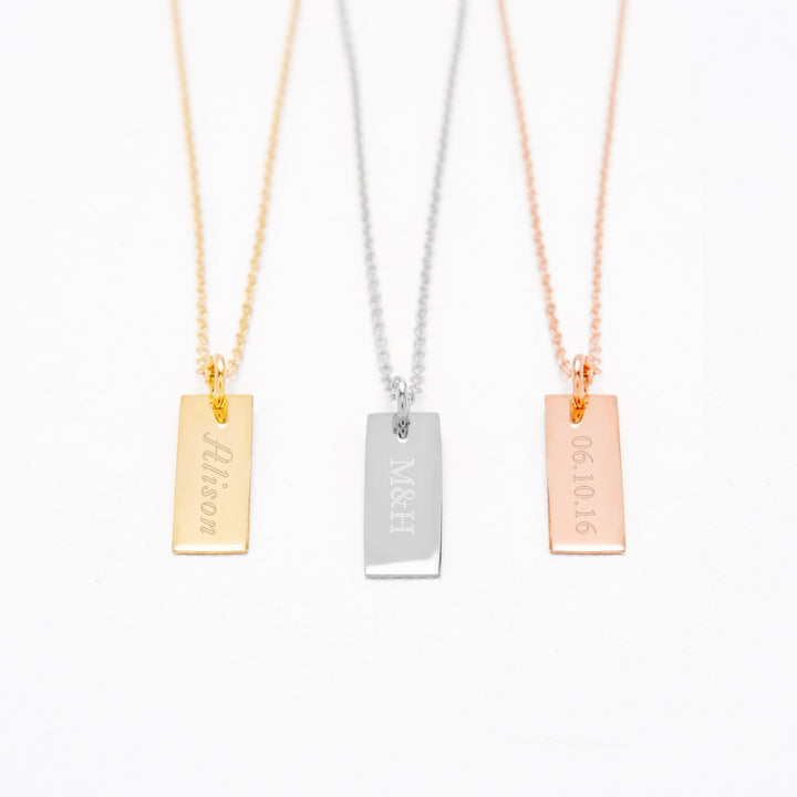 Engravable Petite Vertical Gold Bar Necklace (left to right)